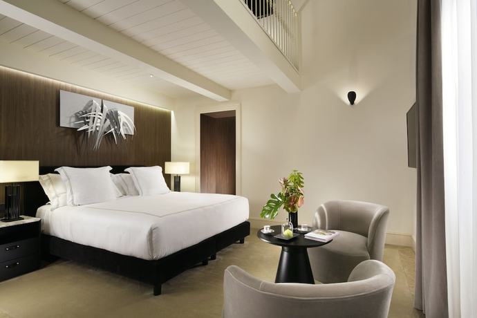 Imagen de la habitación del Hotel The First Roma Dolce. Foto 10