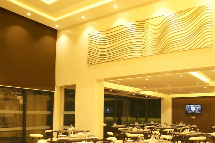 Imagen del bar/restaurante del Hotel The Flora Grand. Foto 6