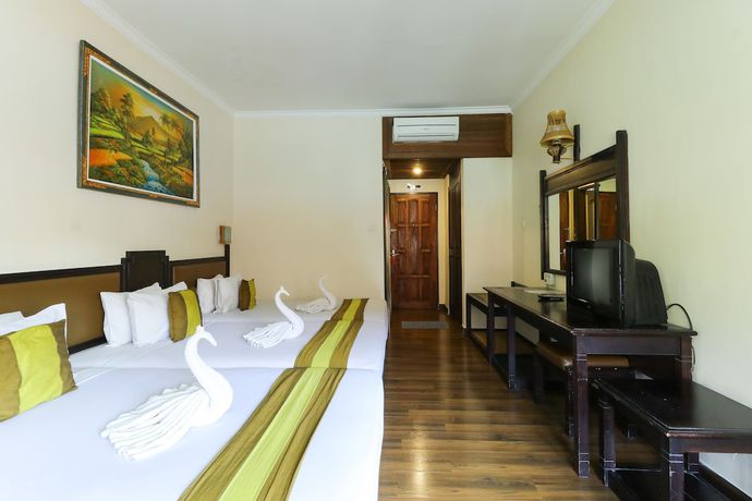 Imagen de la habitación del Hotel The Flora Kuta Bali. Foto 7