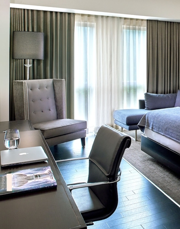 Imagen de la habitación del Hotel The Fontaine. Foto 15