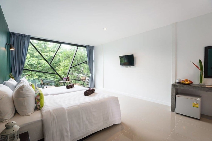 Imagen de la habitación del Hotel The Forest Home Resort. Foto 7