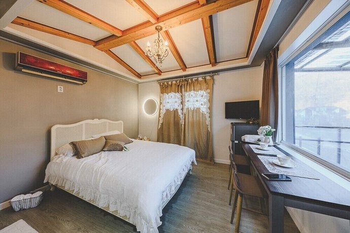 Imagen de la habitación del Hotel The Foret Pension. Foto 19