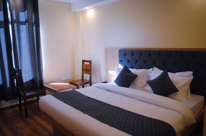 Imagen de la habitación del Hotel The Fragrance. Foto 8