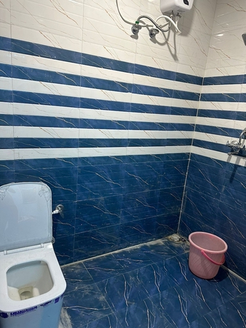 Imagen de la habitación del Hotel The Ganga Residency. Foto 9