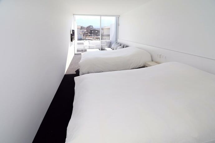 Imagen de la habitación del Hotel The Garden. Foto 17