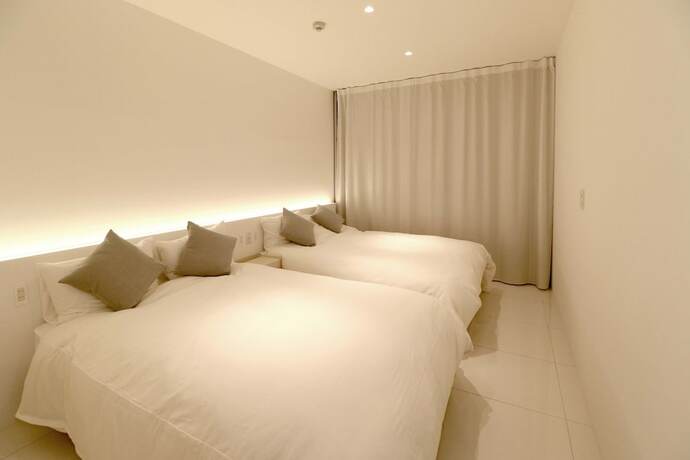 Imagen de la habitación del Hotel The Garden. Foto 23