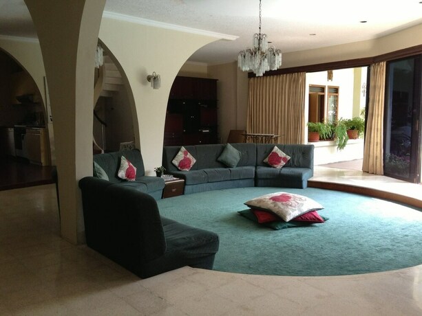 Imagen del bar/restaurante del Hotel The Garden Family Guest House. Foto 12