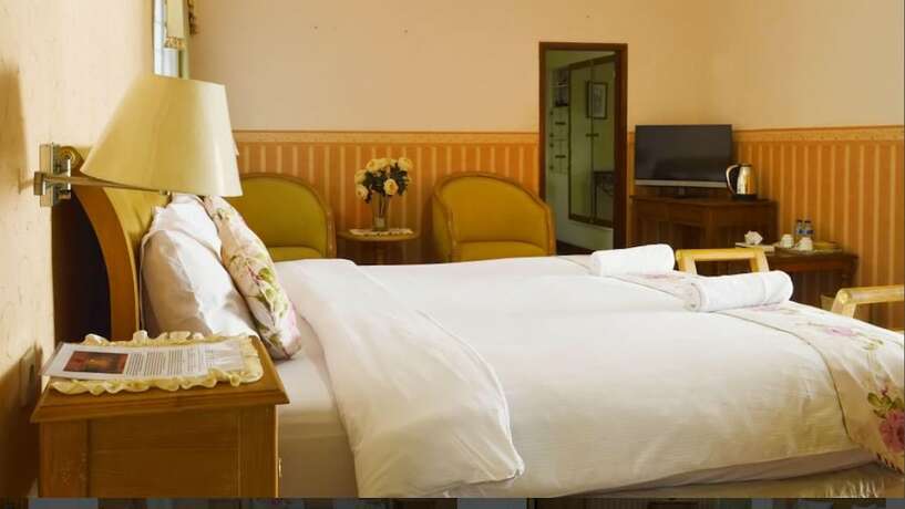 Imagen de la habitación del Hotel The Garden Family Guest House. Foto 15