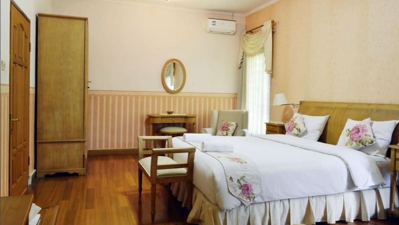 Imagen de la habitación del Hotel The Garden Family Guest House. Foto 17