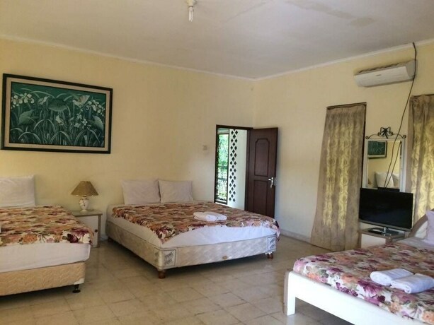 Imagen de la habitación del Hotel The Garden Family Guest House. Foto 19