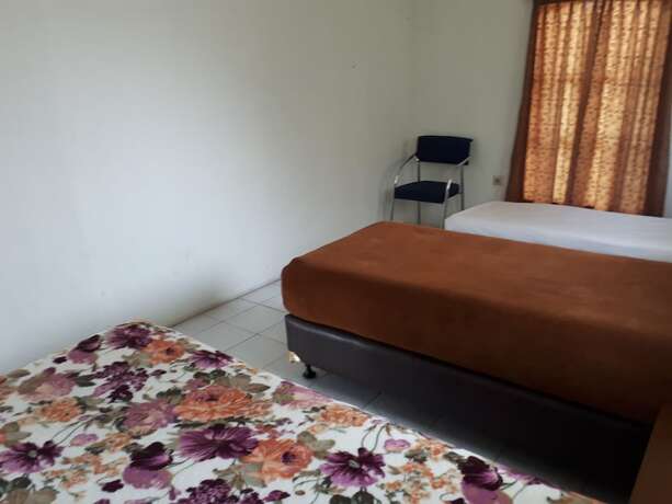 Imagen de la habitación del Hotel The Garden Family Guest House. Foto 20