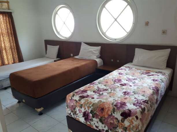 Imagen de la habitación del Hotel The Garden Family Guest House. Foto 27