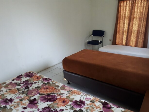 Imagen de la habitación del Hotel The Garden Family Guest House. Foto 29