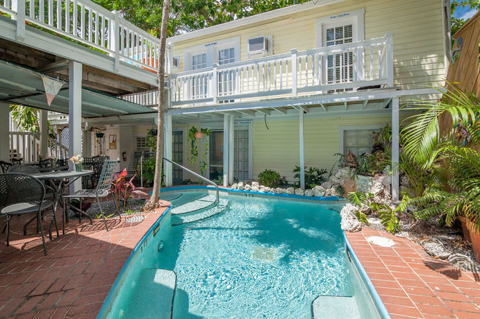 Imagen de la habitación del Hotel The Garden House. Foto 10