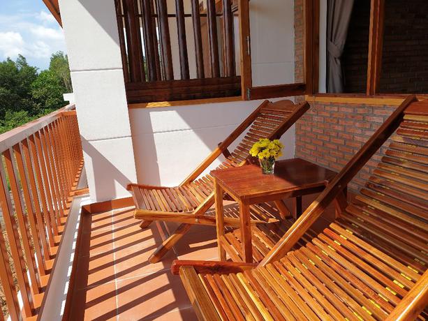 Imagen de la habitación del Hotel The Garden House Phu Quoc Resort. Foto 1