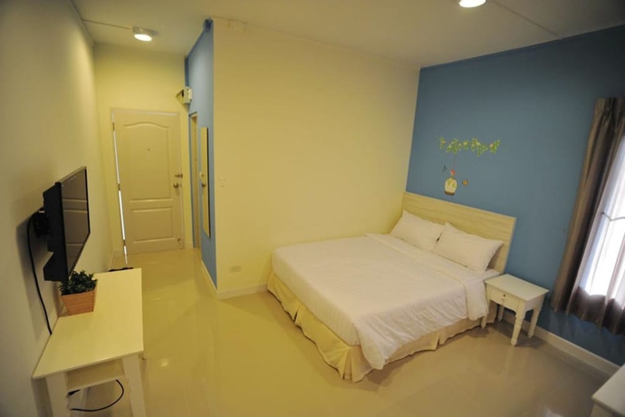 Imagen de la habitación del Hotel The Garden Living. Foto 6