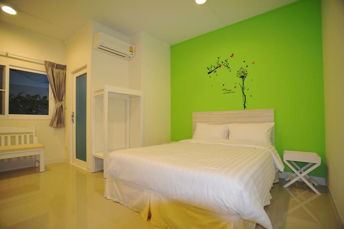 Imagen de la habitación del Hotel The Garden Living. Foto 7