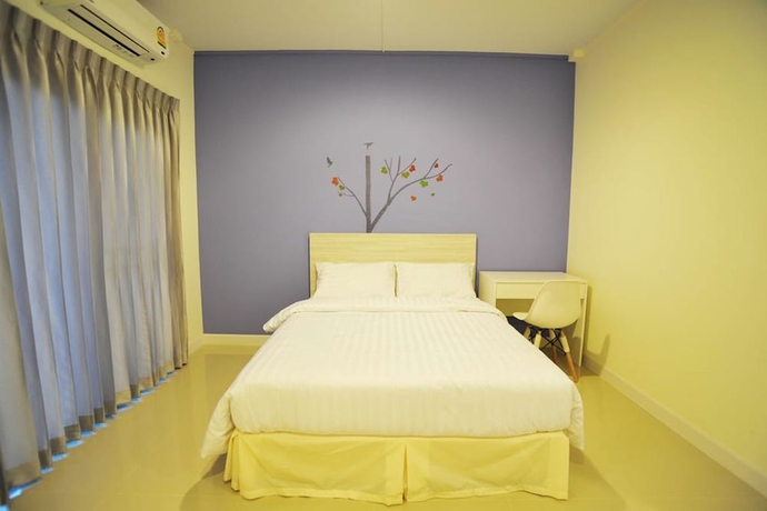 Imagen de la habitación del Hotel The Garden Living. Foto 10