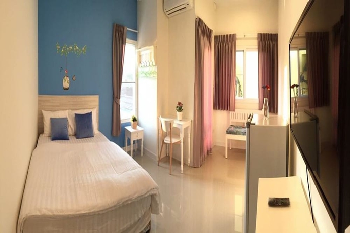 Imagen de la habitación del Hotel The Garden Living. Foto 11