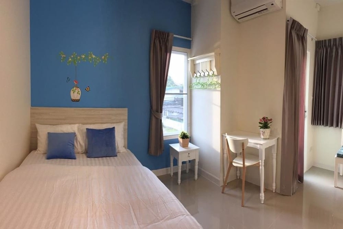 Imagen de la habitación del Hotel The Garden Living. Foto 13