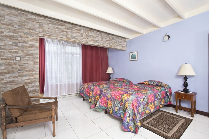 Imagen de la habitación del Hotel The Gardens. Foto 5