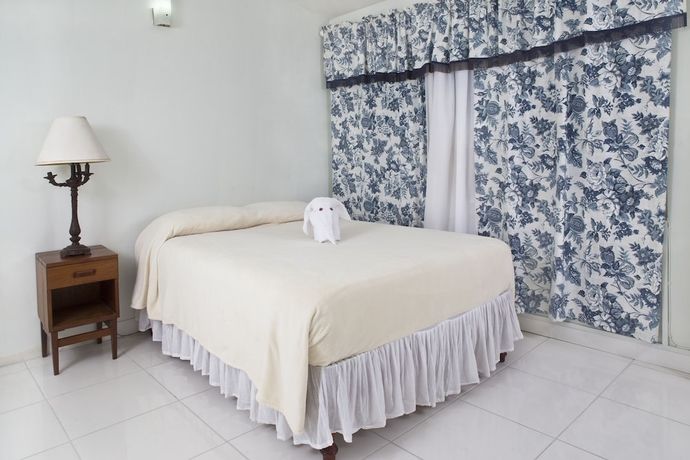 Imagen de la habitación del Hotel The Gardens. Foto 8