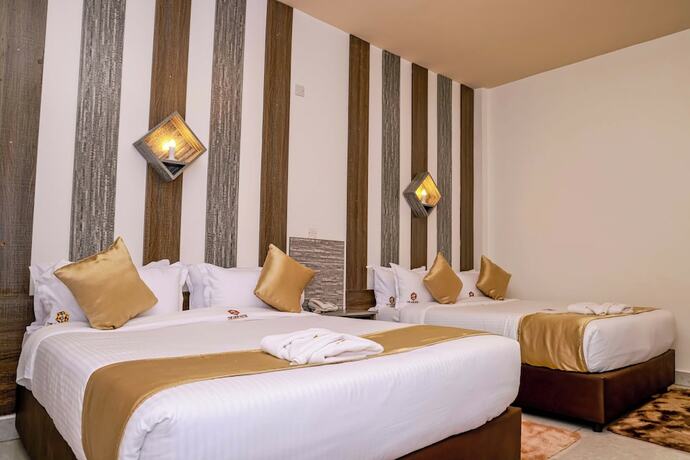 Imagen de la habitación del Hotel The Gem. Foto 17