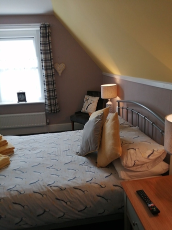Imagen de la habitación del Hotel The George BandB. Foto 12