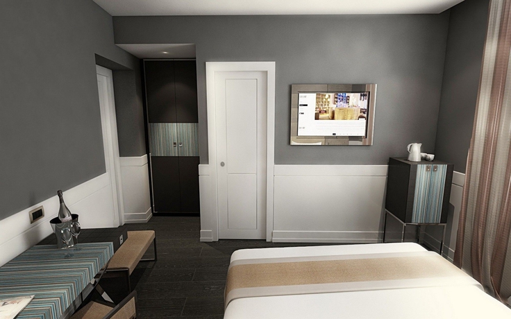 Imagen de la habitación del Hotel The Glam. Foto 11