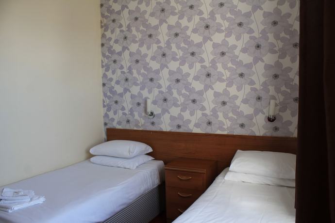 Imagen de la habitación del Hotel The Glastonbury. Foto 6