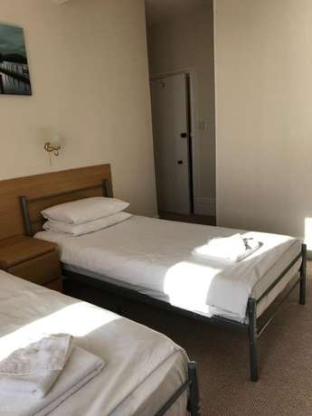 Imagen de la habitación del Hotel The Glastonbury. Foto 8