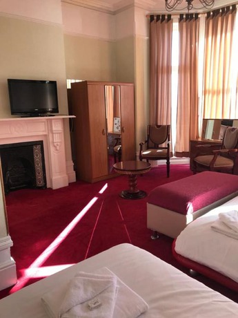 Imagen de la habitación del Hotel The Glastonbury. Foto 11