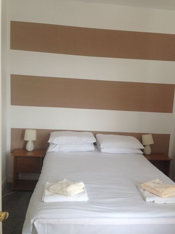 Imagen de la habitación del Hotel The Glastonbury. Foto 14