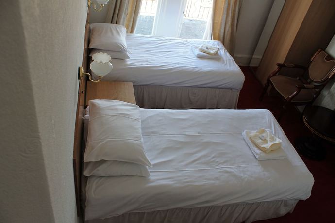 Imagen de la habitación del Hotel The Glastonbury. Foto 16