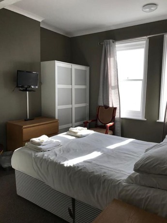 Imagen de la habitación del Hotel The Glastonbury. Foto 17