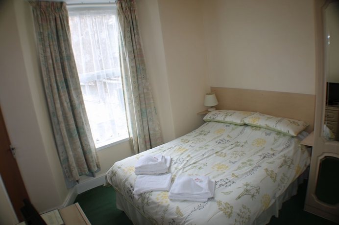 Imagen de la habitación del Hotel The Glendeveor. Foto 6
