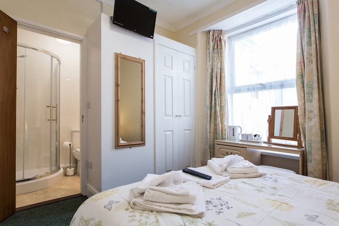 Imagen de la habitación del Hotel The Glendeveor. Foto 18