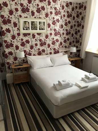 Imagen de la habitación del Hotel The Glenwood. Foto 5