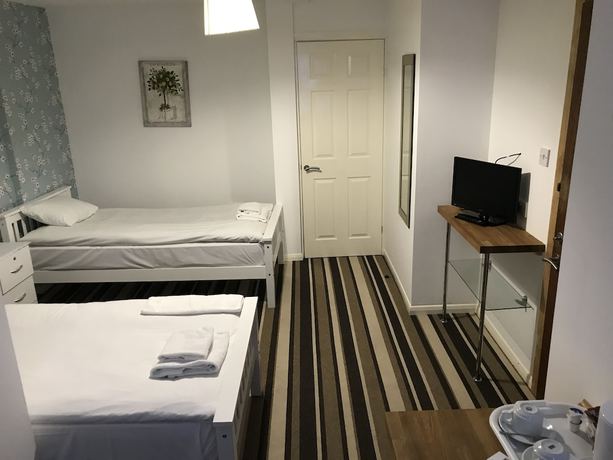 Imagen de la habitación del Hotel The Glenwood. Foto 13