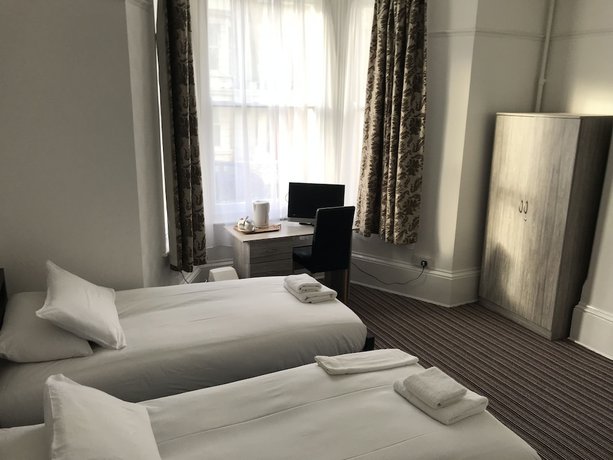 Imagen de la habitación del Hotel The Glenwood. Foto 15