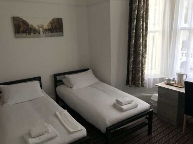 Imagen de la habitación del Hotel The Glenwood. Foto 16