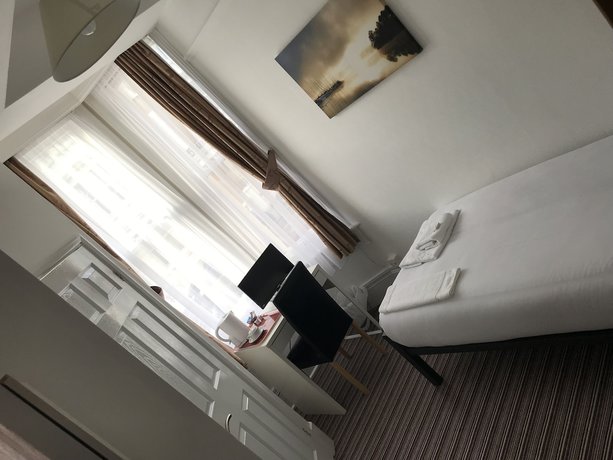 Imagen de la habitación del Hotel The Glenwood. Foto 18