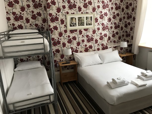 Imagen de la habitación del Hotel The Glenwood. Foto 19