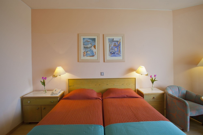 Imagen de la habitación del Hotel The Golden Coast Beach. Foto 6