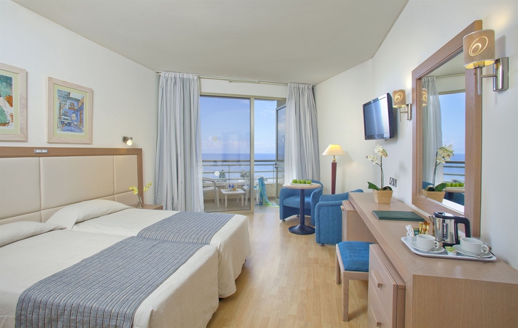 Imagen de la habitación del Hotel The Golden Coast Beach. Foto 8