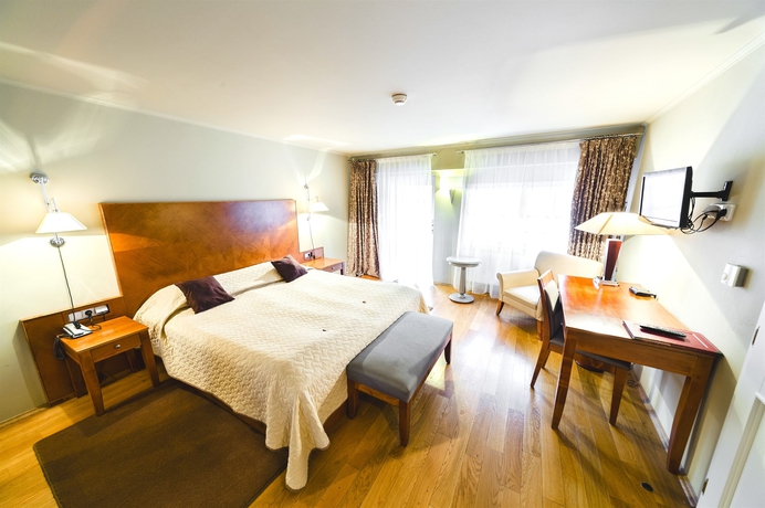 Imagen de la habitación del Hotel The Golden Wheel. Foto 9