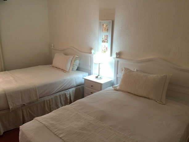 Imagen de la habitación del Hotel The Golf Suites. Foto 9