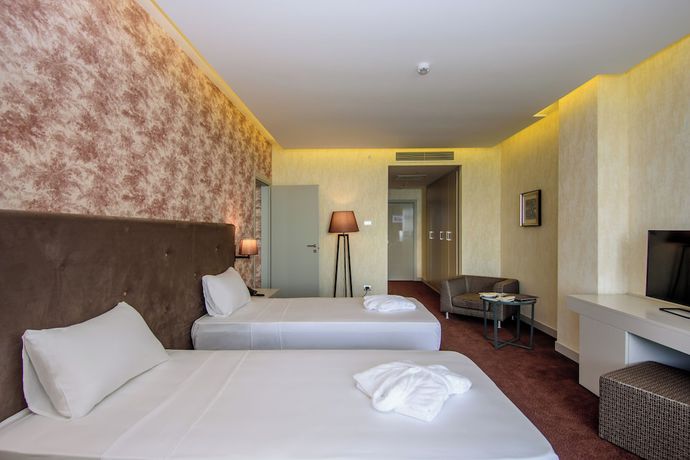 Imagen de la habitación del Hotel The Grand Gloria. Foto 12