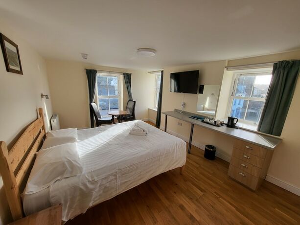 Imagen de la habitación del Hotel The Grand Harbour. Foto 16