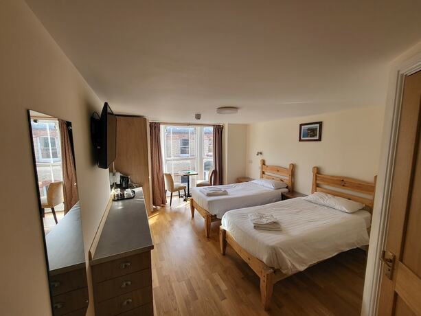 Imagen de la habitación del Hotel The Grand Harbour. Foto 18